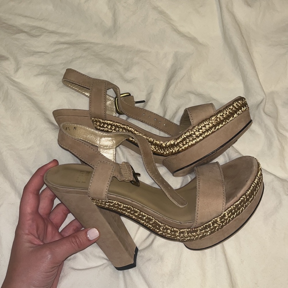Stuart Weitzman platform nude sandals.